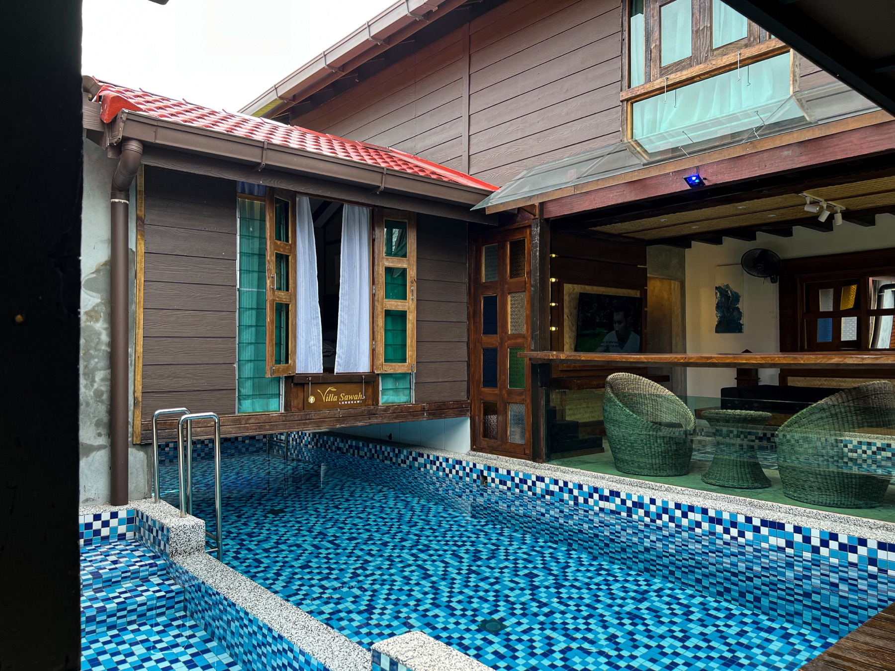 Villa Feyra private pool with timber doors and living area